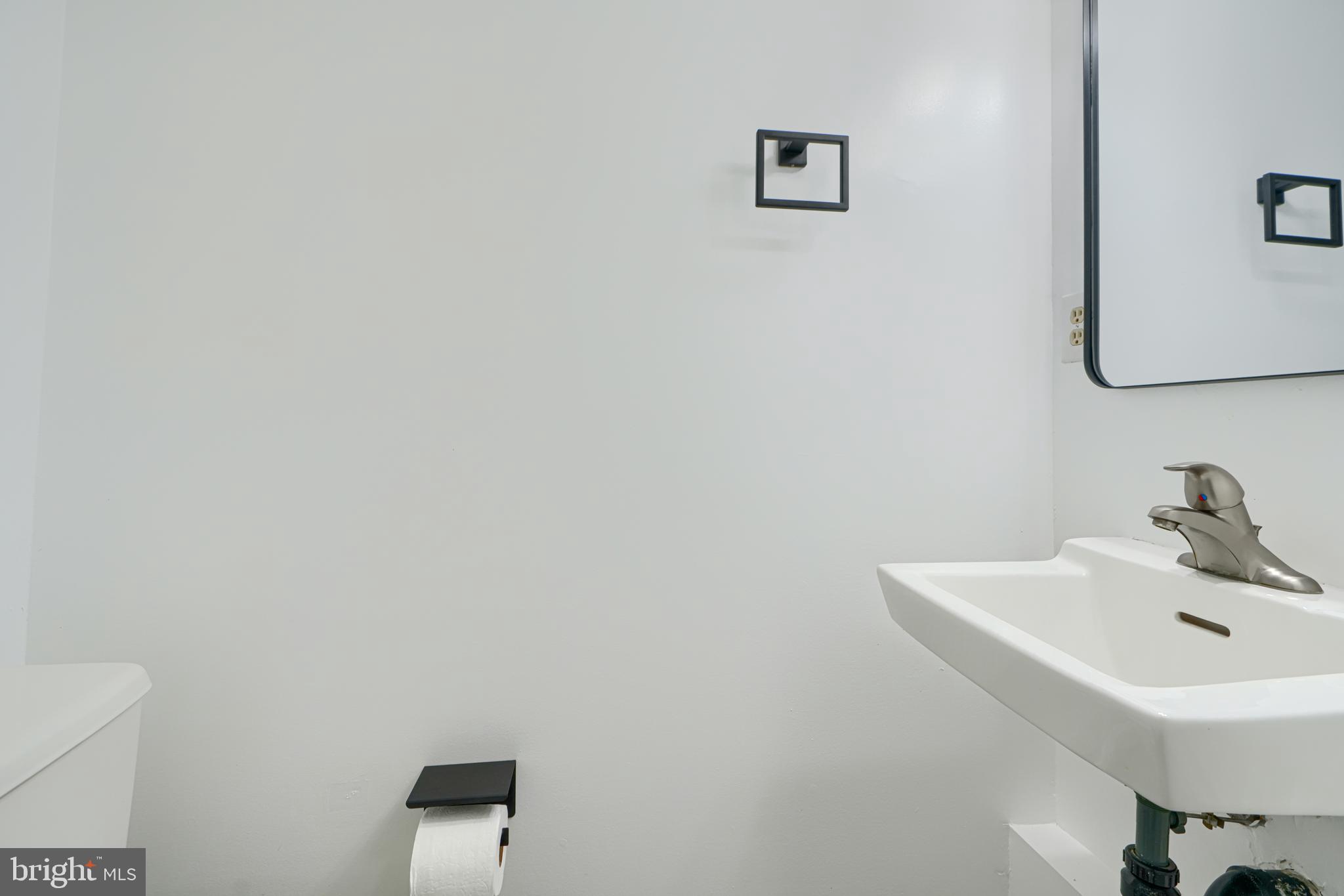 6 Stillwood Circle Nottingham, MD 21236 - Photo 13 of 26 a bathroom with a sink and a mirror