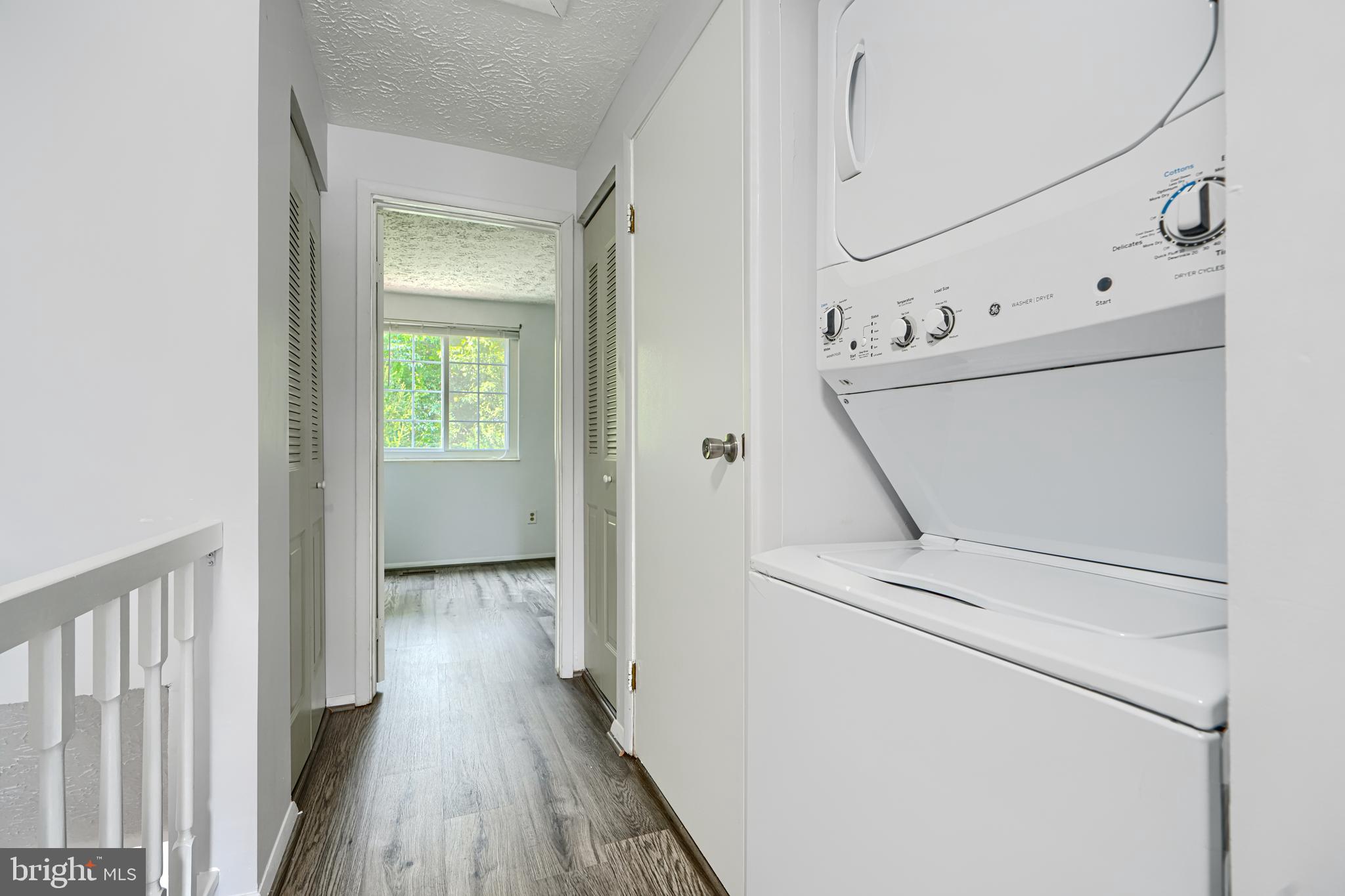 6 Stillwood Circle Nottingham, MD 21236 - Photo 14 of 26 a view of a hallway with wooden floor and cabinet