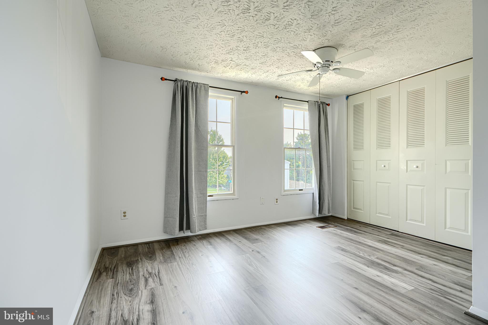 6 Stillwood Circle Nottingham, MD 21236 - Photo 16 of 26 a view of an empty room with wooden floor and a window