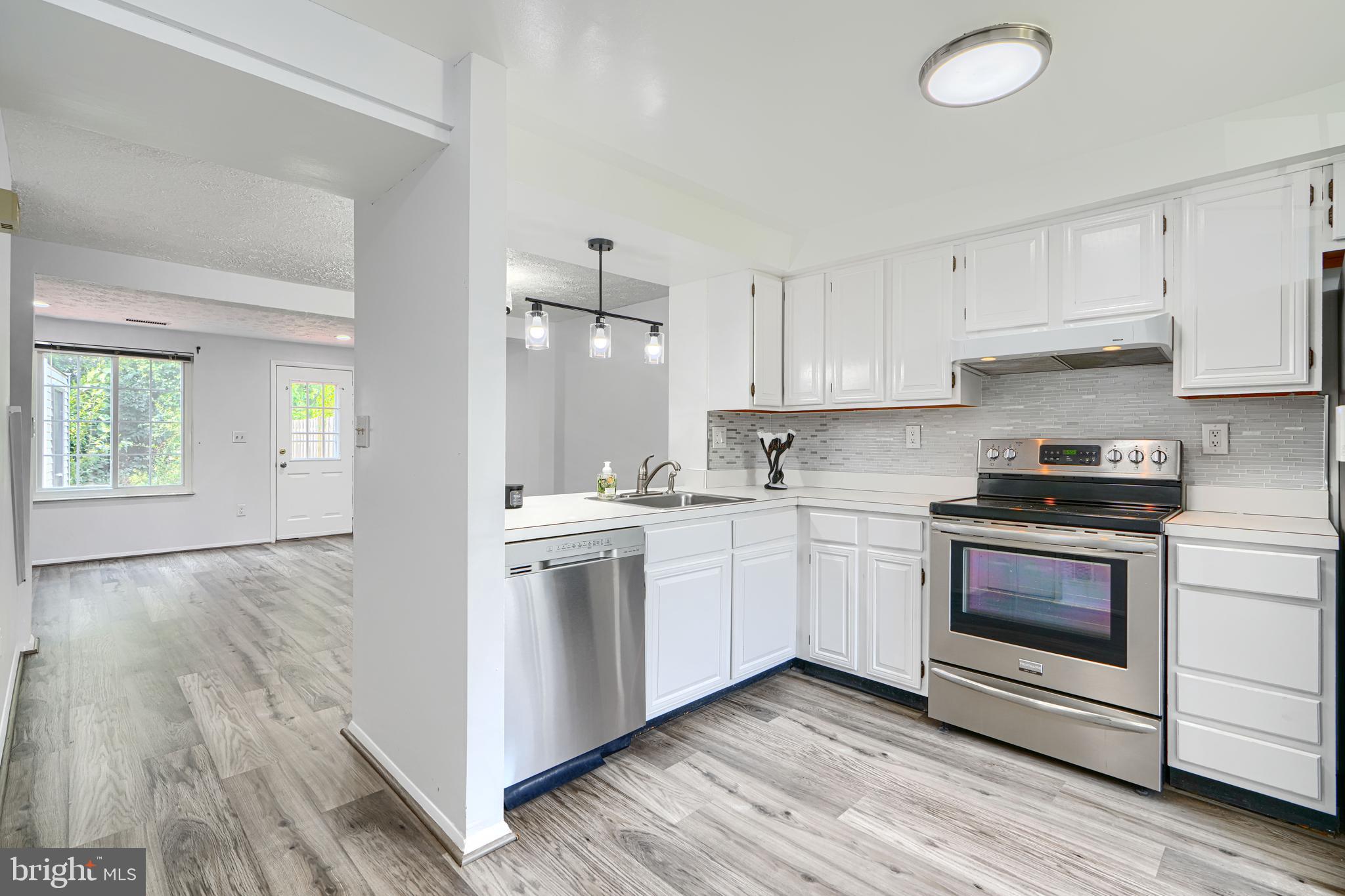 6 Stillwood Circle Nottingham, MD 21236 - Photo 2 of 26 a kitchen with granite countertop a sink cabinets and stainless steel appliances
