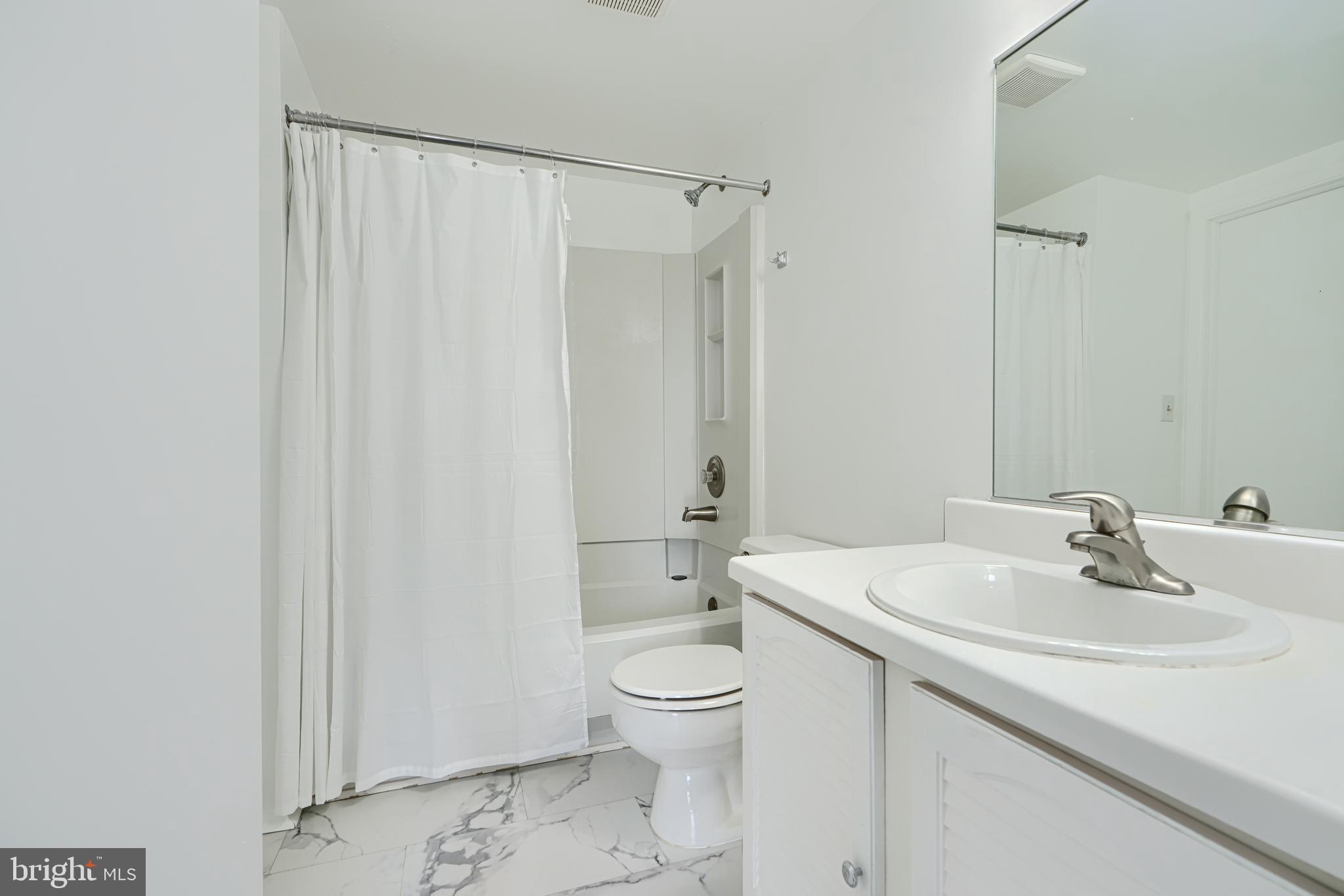 6 Stillwood Circle Nottingham, MD 21236 - Photo 21 of 26 a bathroom with a sink toilet and shower