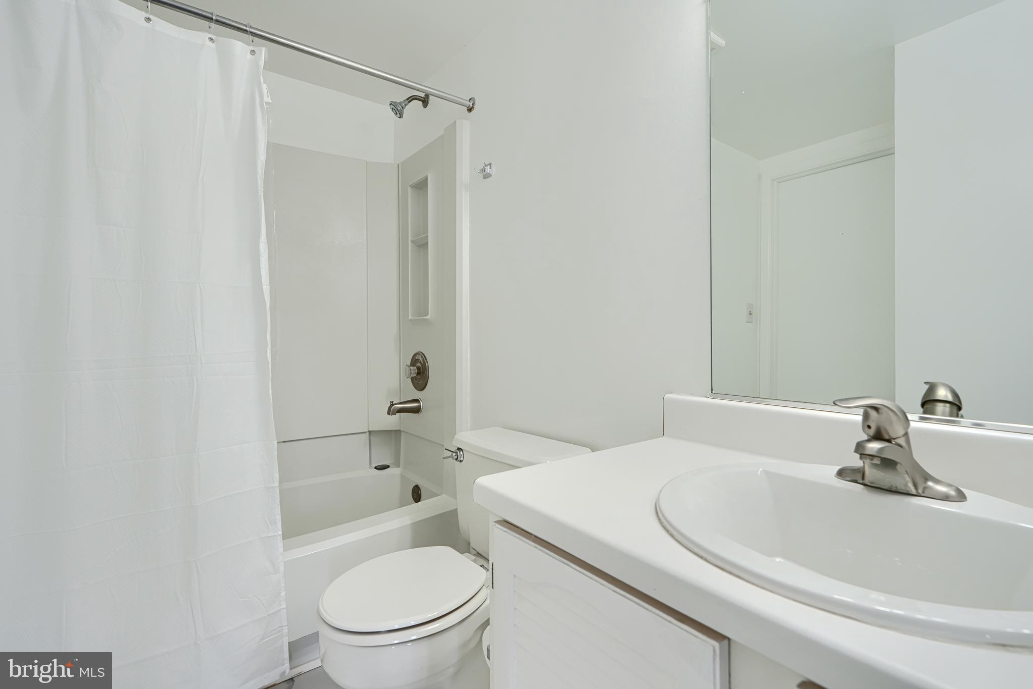 6 Stillwood Circle Nottingham, MD 21236 - Photo 22 of 26 a bathroom with a sink a toilet and shower