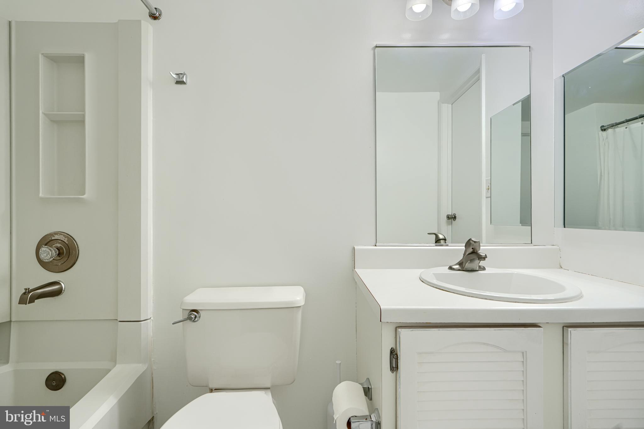 6 Stillwood Circle Nottingham, MD 21236 - Photo 23 of 26 a bathroom with a sink a toilet and shower