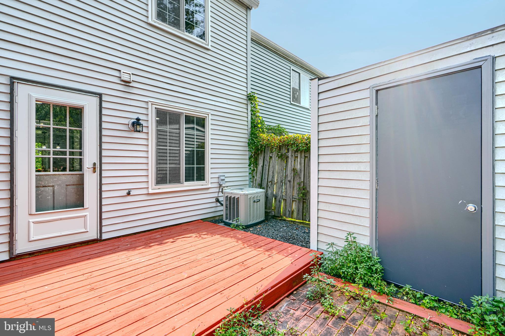 6 Stillwood Circle Nottingham, MD 21236 - Photo 25 of 26 a backyard of a house with wooden floor and fence