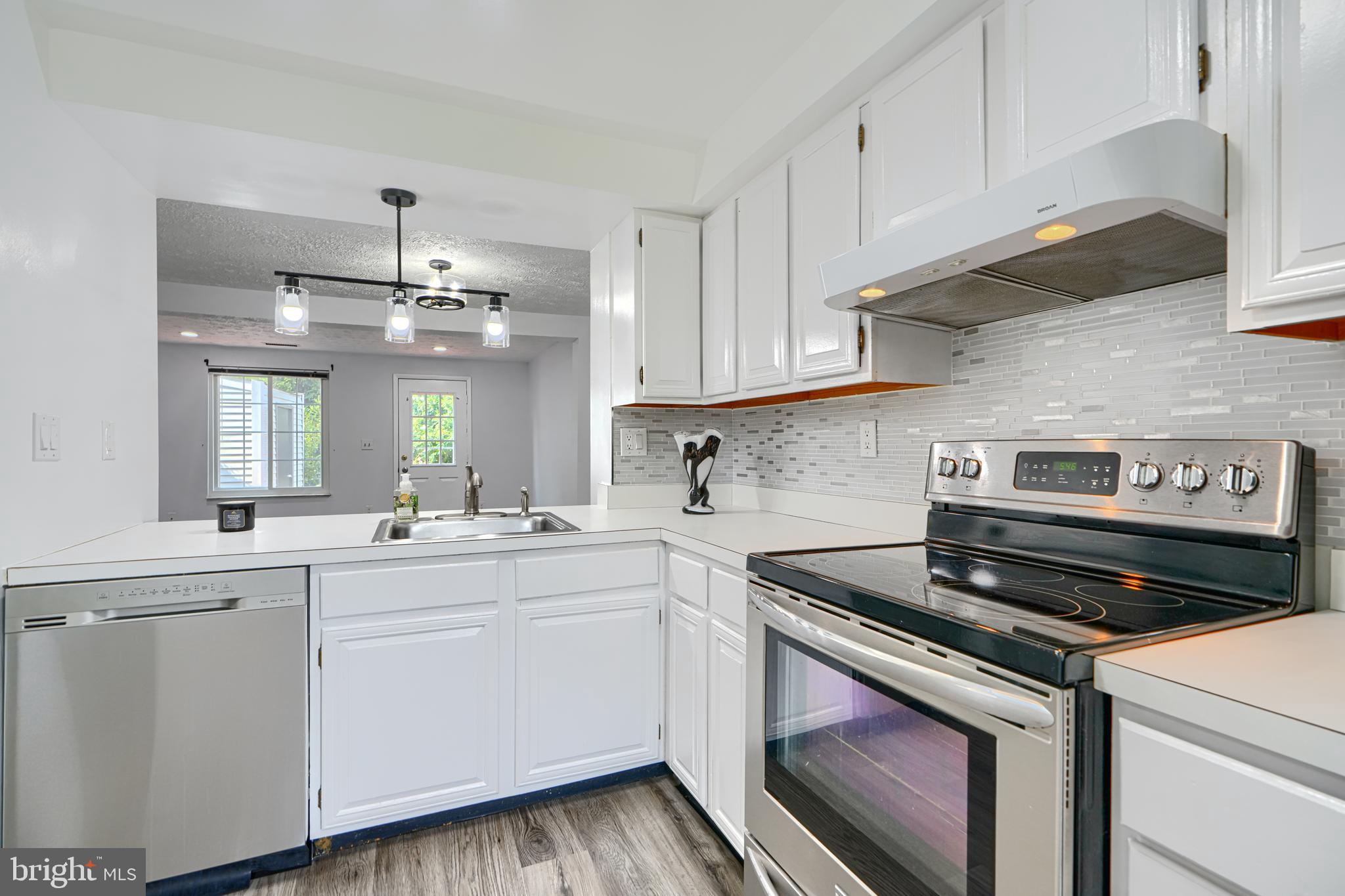 6 Stillwood Circle Nottingham, MD 21236 - Photo 5 of 26 a kitchen with a sink stove and cabinets