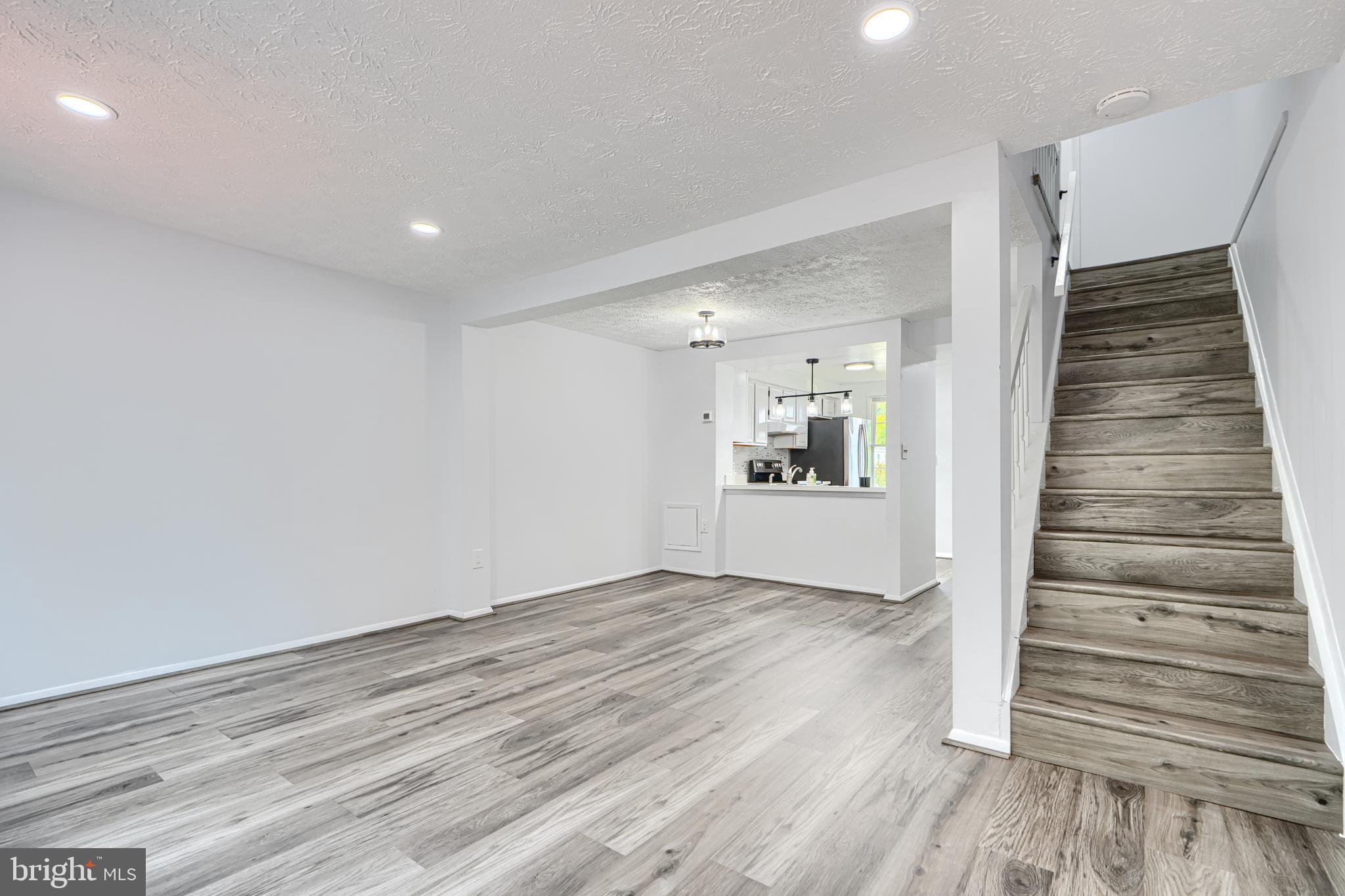 6 Stillwood Circle Nottingham, MD 21236 - Photo 9 of 26 wooden floor in an empty room with wooden floor