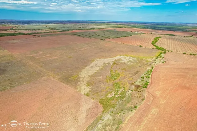 a view of a swimming pool and an outdoor space