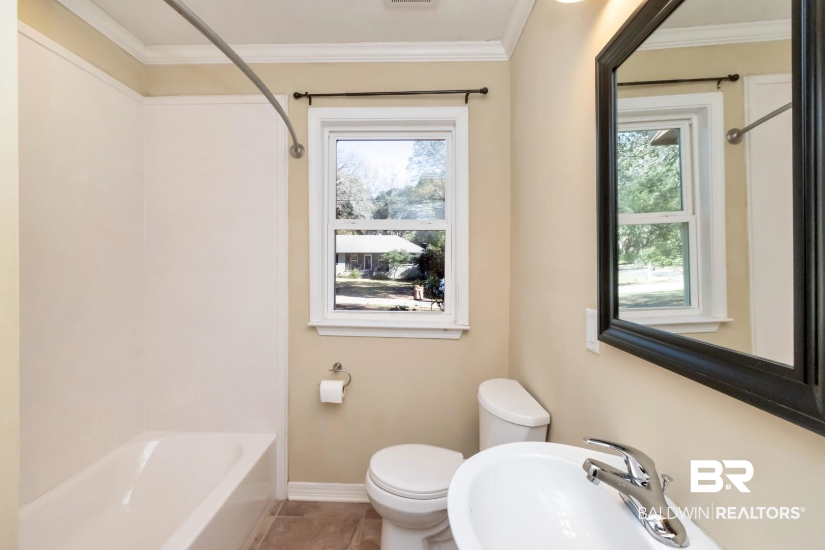 410 St John Place Mobile, AL 36609 - Photo 16 of 32 Bathroom featuring shower / bath combination, crown molding, and tile patterned flooring