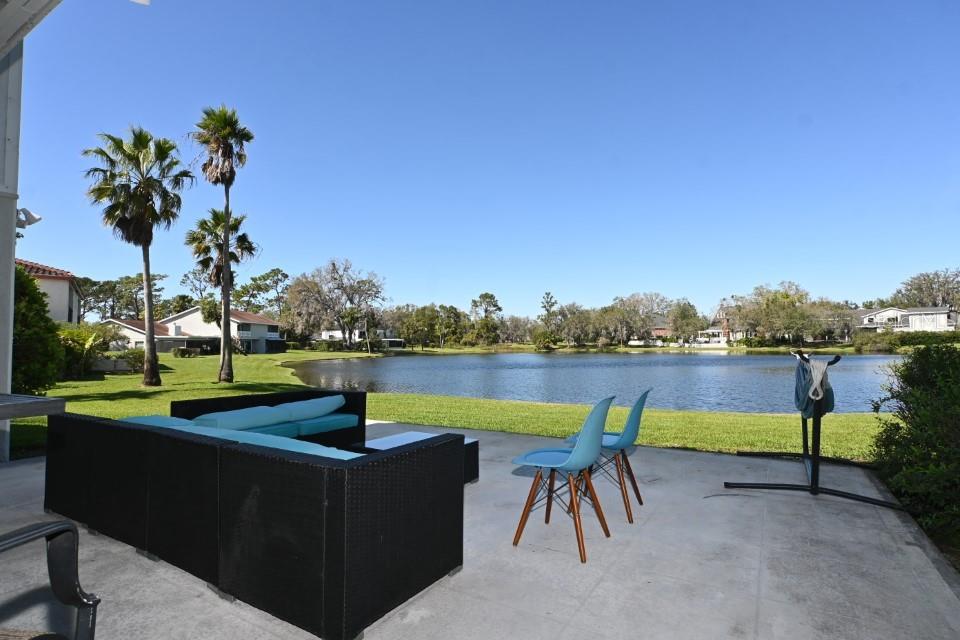 5348 Saddlebrook Way, Unit 2 Wesley Chapel, FL 33543 - Photo 14 of 38 a view of swimming pool with lake view