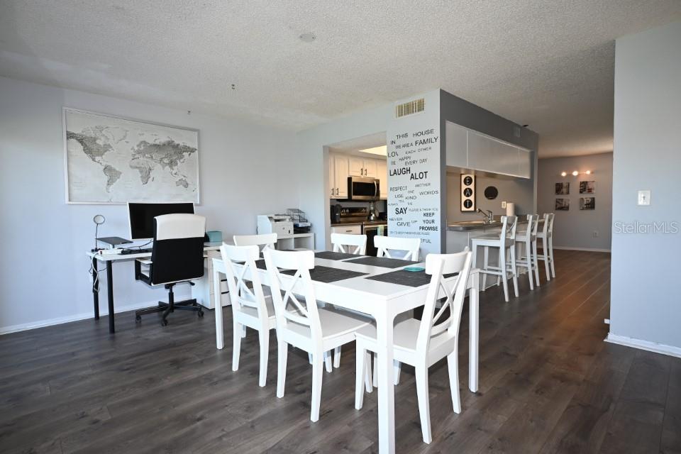 5348 Saddlebrook Way, Unit 2 Wesley Chapel, FL 33543 - Photo 15 of 38 a view of a dining room with furniture and wooden floor