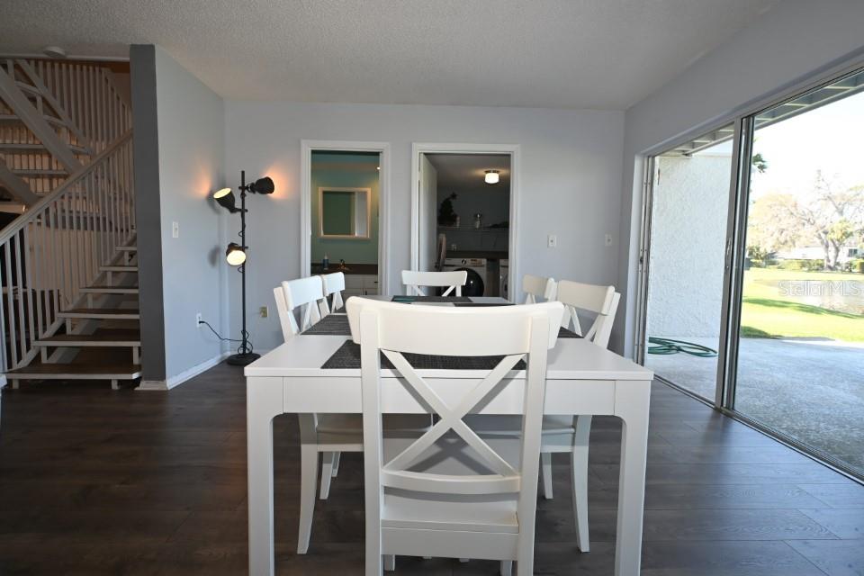 5348 Saddlebrook Way, Unit 2 Wesley Chapel, FL 33543 - Photo 17 of 38 a view of a dining room with furniture window and wooden floor