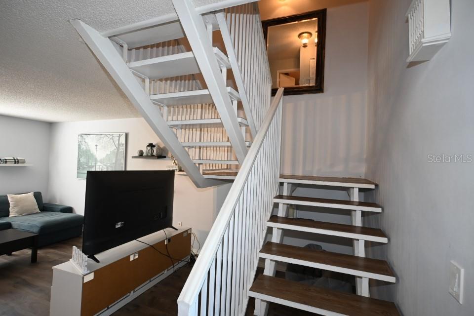 5348 Saddlebrook Way, Unit 2 Wesley Chapel, FL 33543 - Photo 19 of 38 a view of entryway and hall with wooden floor