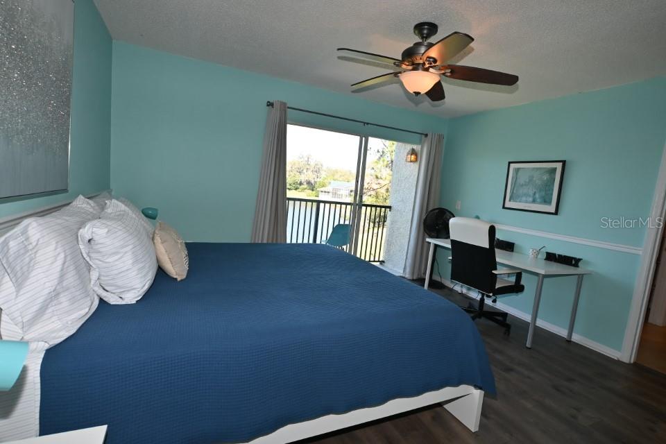 5348 Saddlebrook Way, Unit 2 Wesley Chapel, FL 33543 - Photo 21 of 38 a bed sitting in a bedroom next to a window