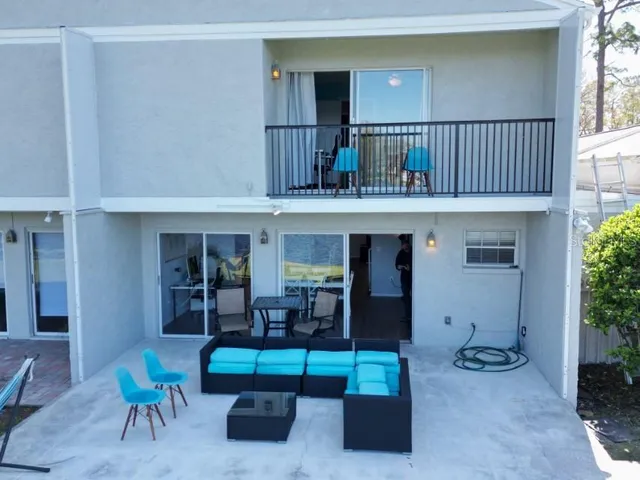 a hallway with furniture and a window