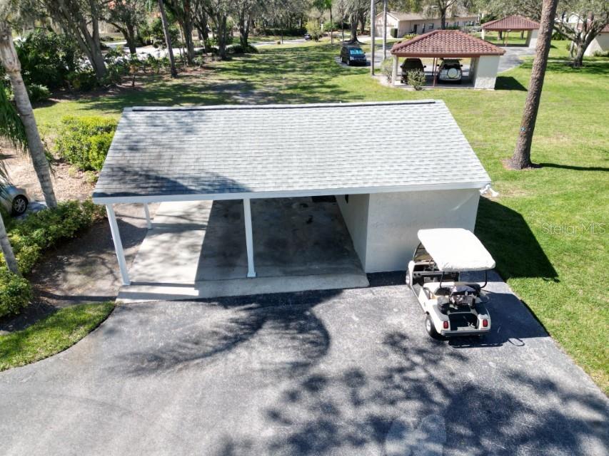 5348 Saddlebrook Way, Unit 2 Wesley Chapel, FL 33543 - Photo 32 of 38 a front view of a house with a yard