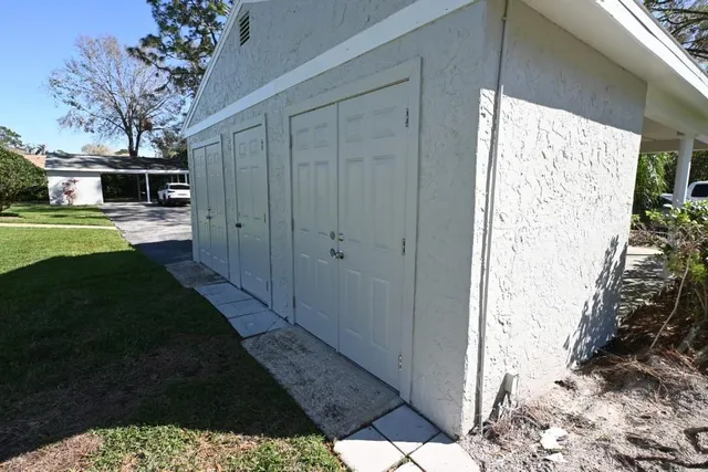 a view of a yard from a corridor