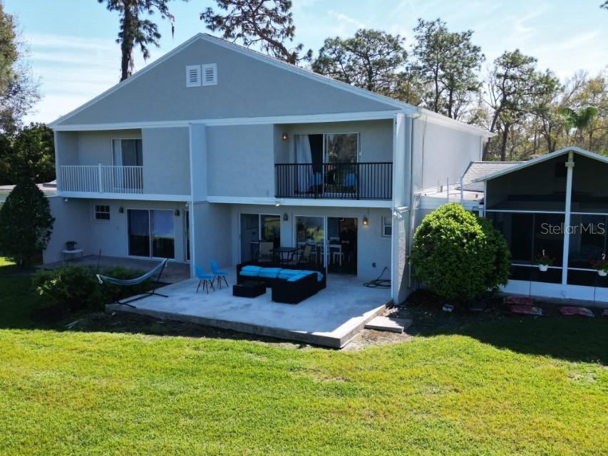 5348 Saddlebrook Way, Unit 2 Wesley Chapel, FL 33543 - Photo 35 of 38 a front view of a house with garden