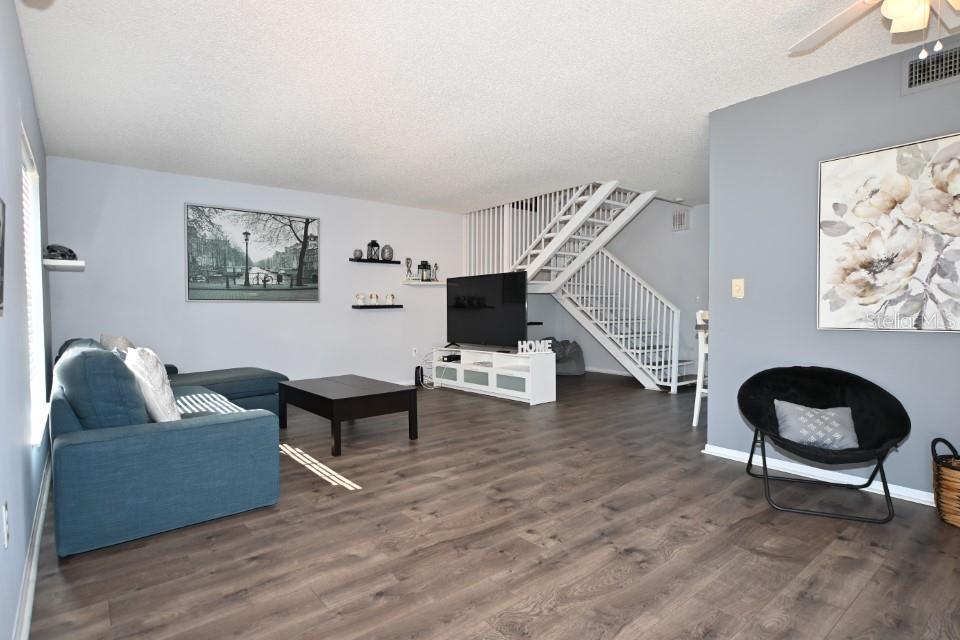 5348 Saddlebrook Way, Unit 2 Wesley Chapel, FL 33543 - Photo 5 of 38 a living room with furniture and a wooden floor