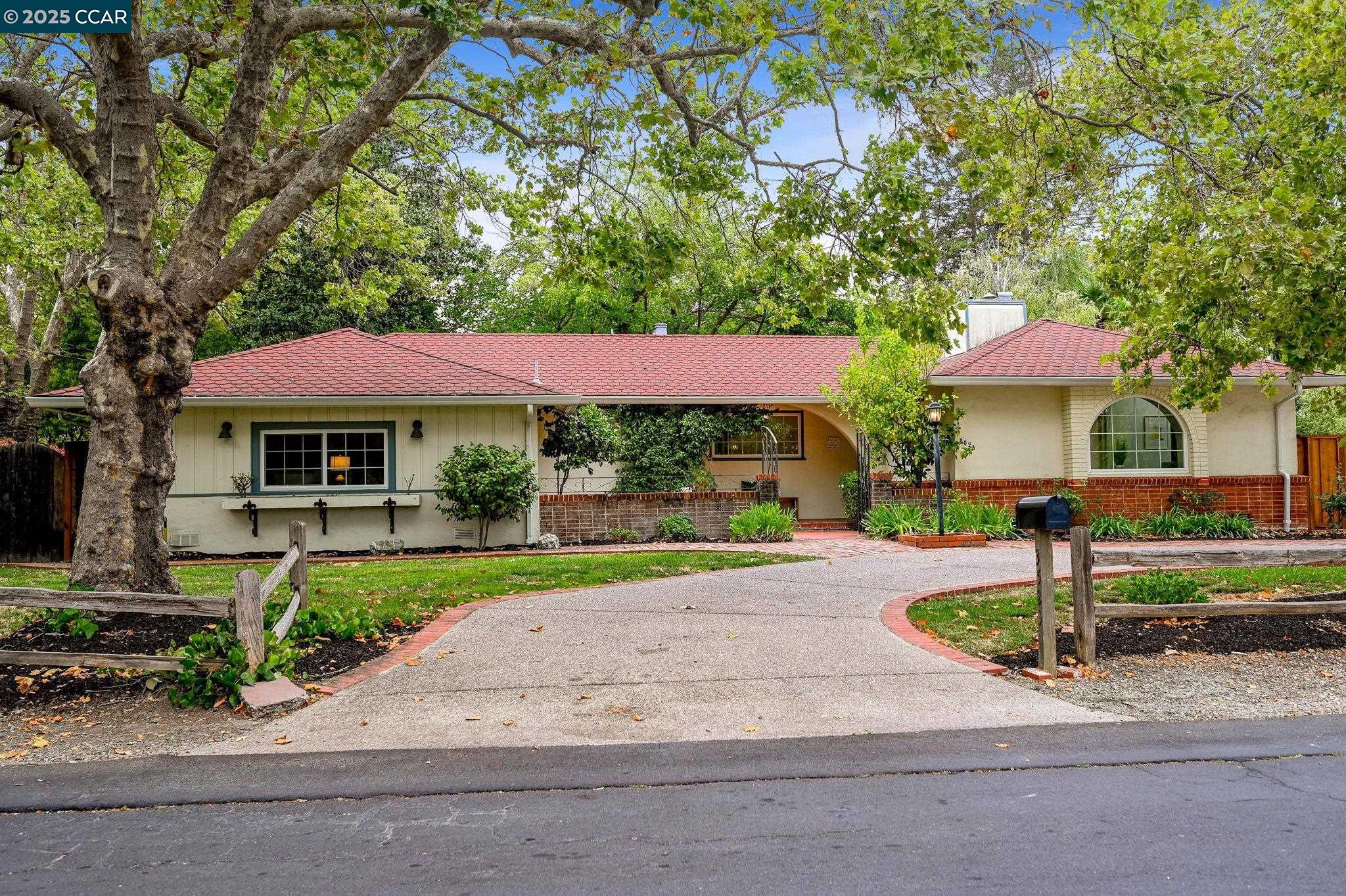a front view of a house with a yard and porch