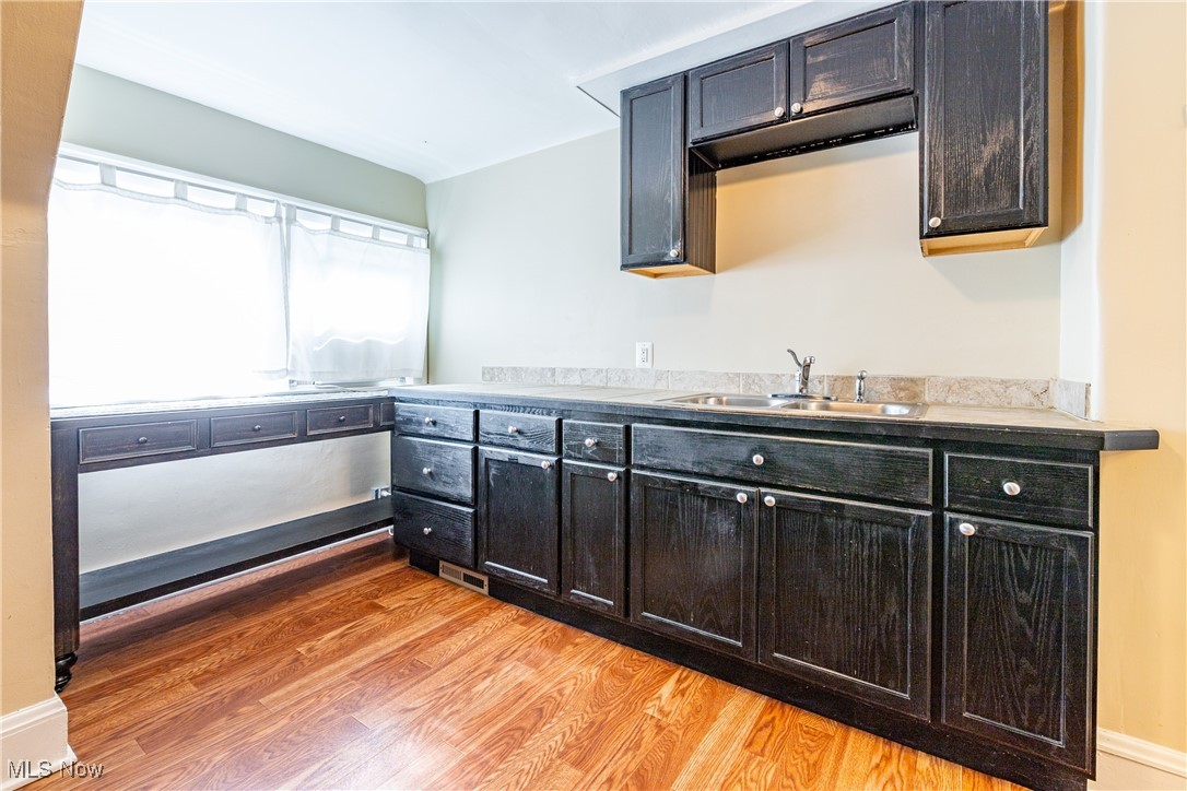 3232 Clarendon Road Cleveland, OH 44118 - Photo 16 of 22 Kitchen featuring sink and light wood-type flooring