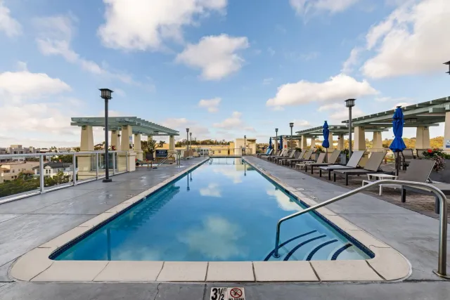 a view of swimming pool with outdoor seating