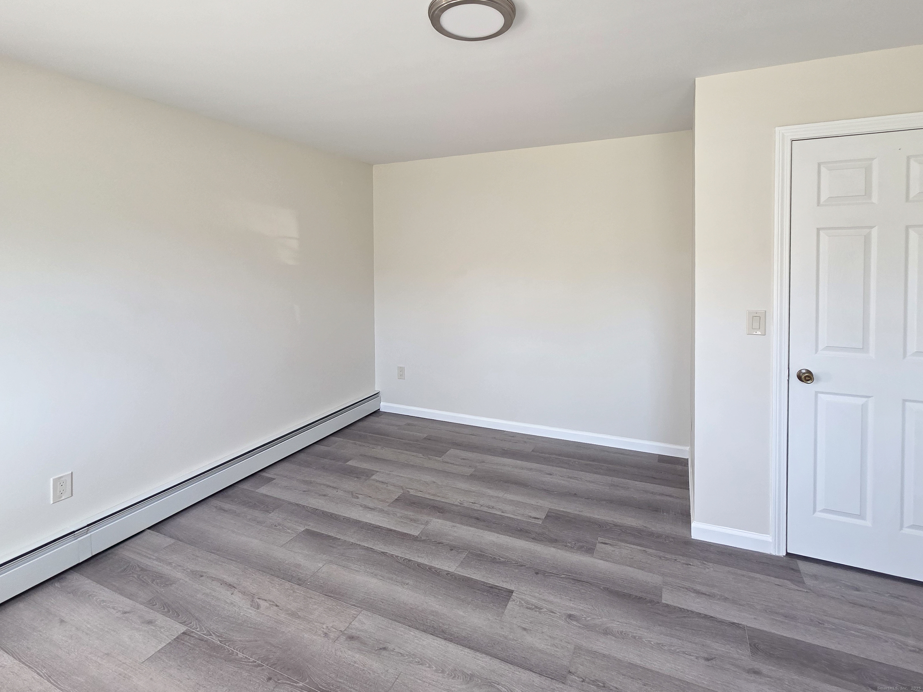 7 Dally Farm Road Windsor, CT 06095 - Photo 11 of 23 a view of an empty room with wooden floor and closet