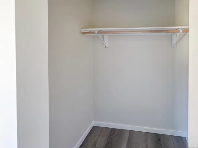 a view of a room with racks on the wall