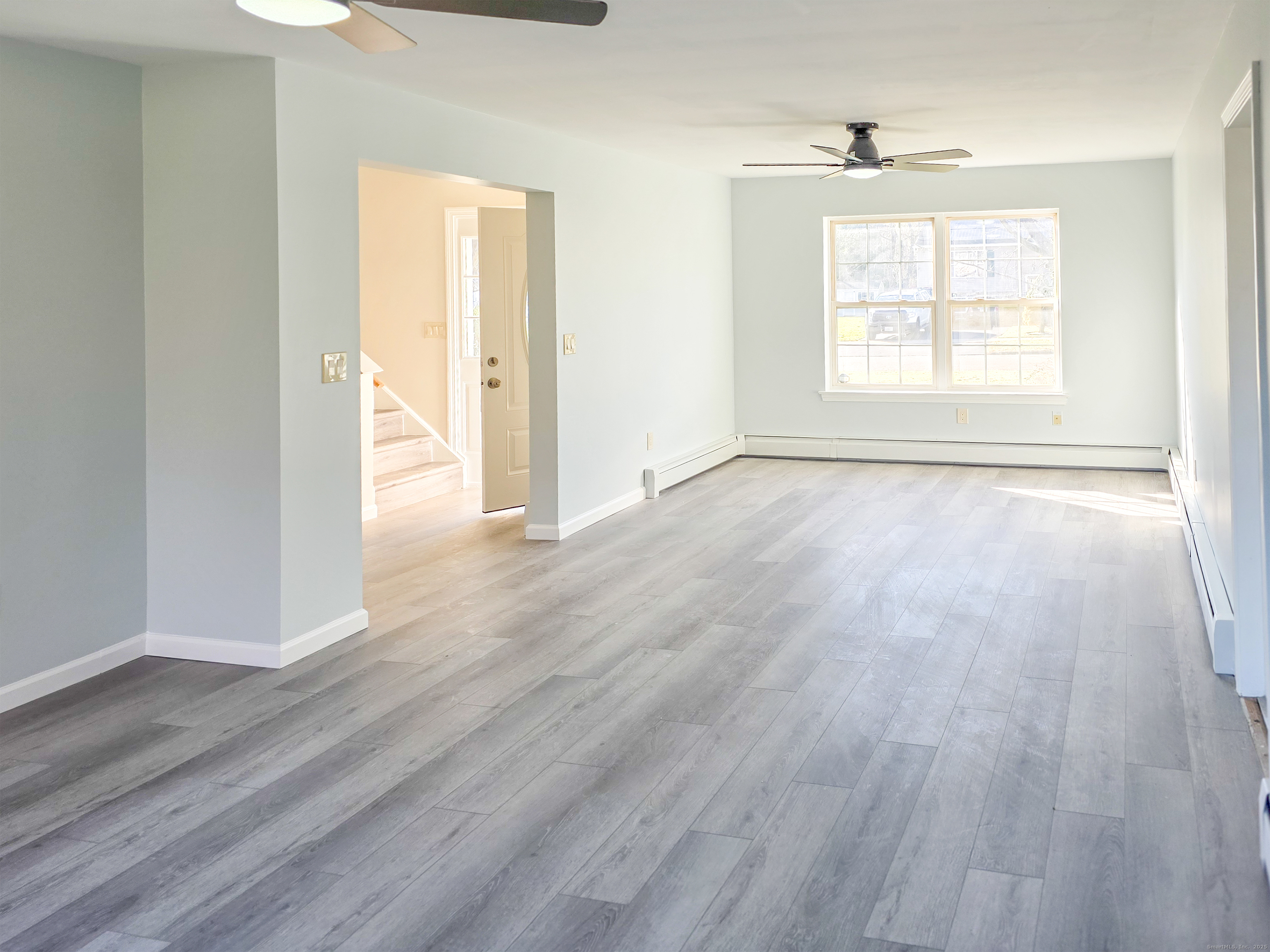 7 Dally Farm Road Windsor, CT 06095 - Photo 16 of 23 an empty room with wooden floor and windows