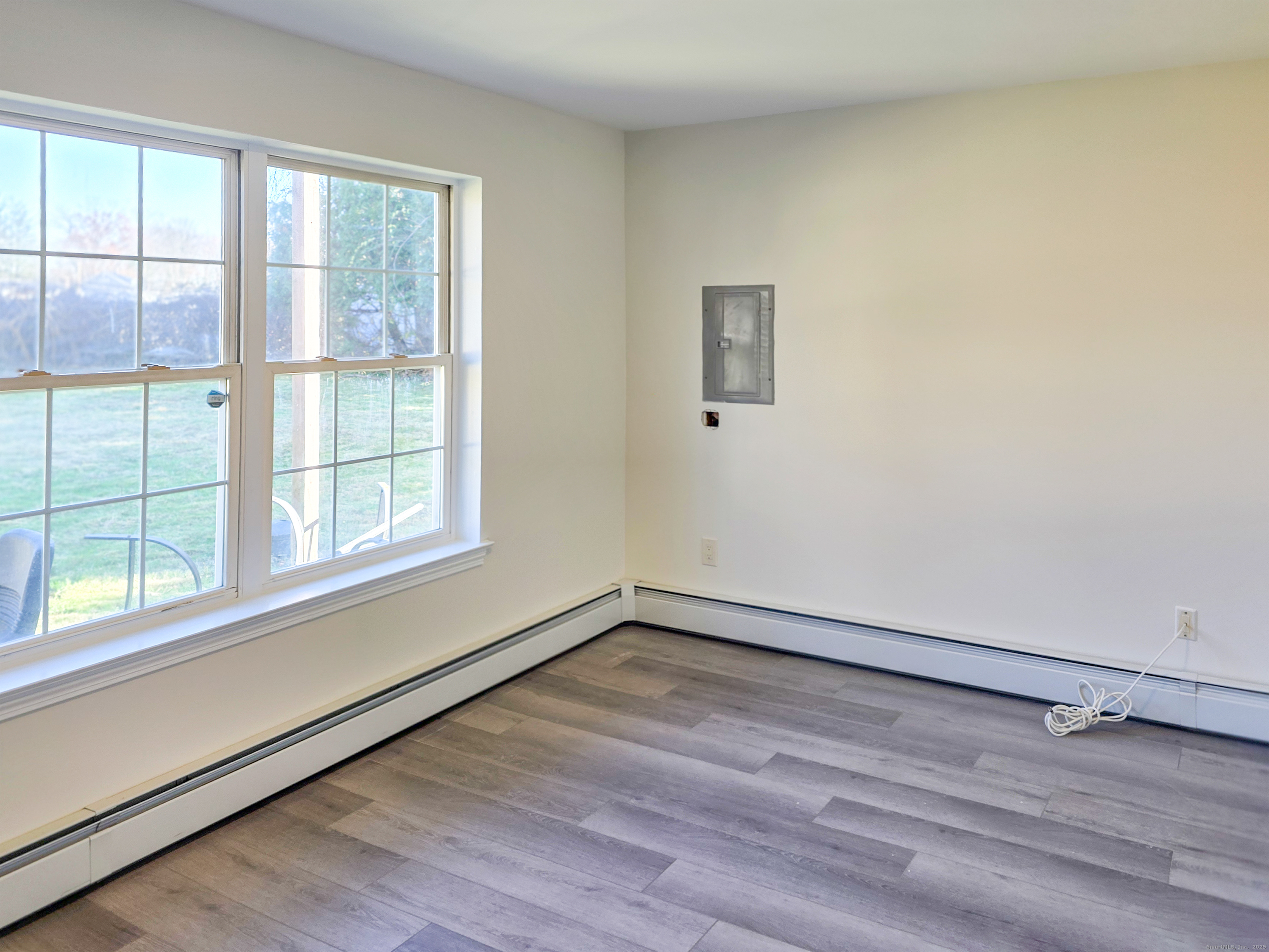 7 Dally Farm Road Windsor, CT 06095 - Photo 21 of 23 wooden floor in an empty room with a window