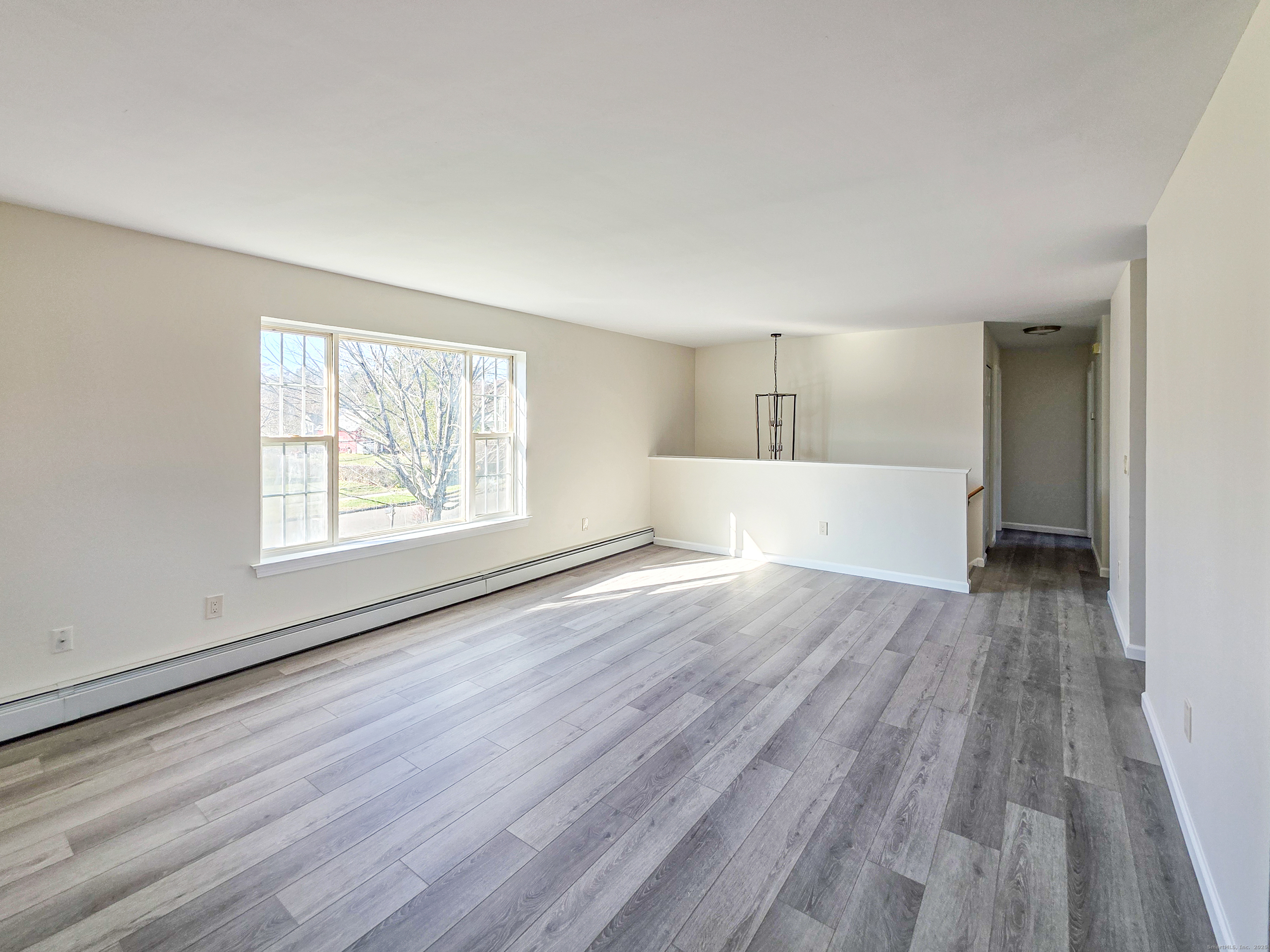 7 Dally Farm Road Windsor, CT 06095 - Photo 8 of 23 wooden floor in an empty room with a window