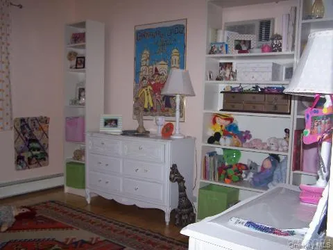 a room with toys and dresser