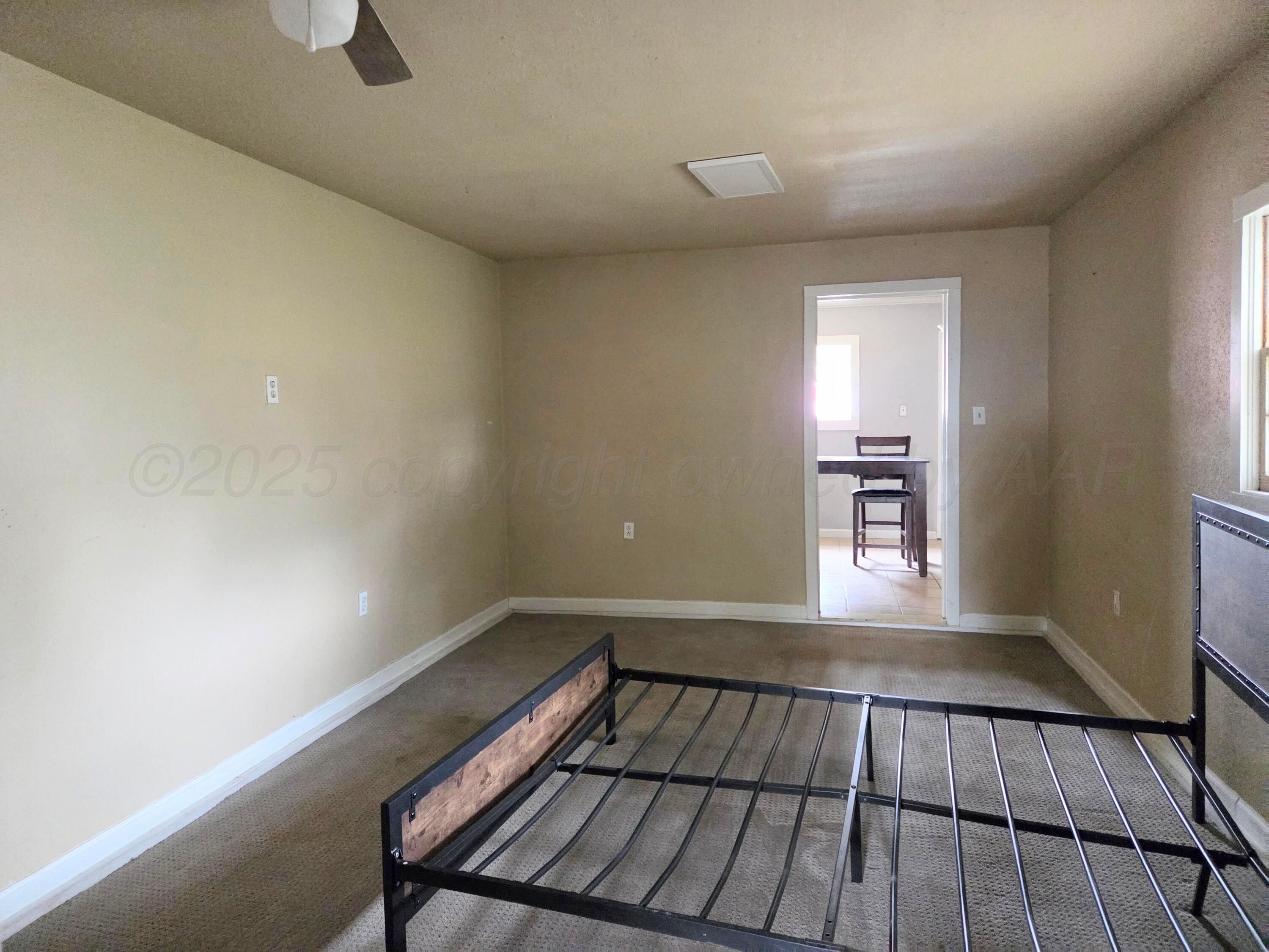 231 Main Street Quitaque, TX 79255 - Photo 11 of 23 a view of wooden floor in a room