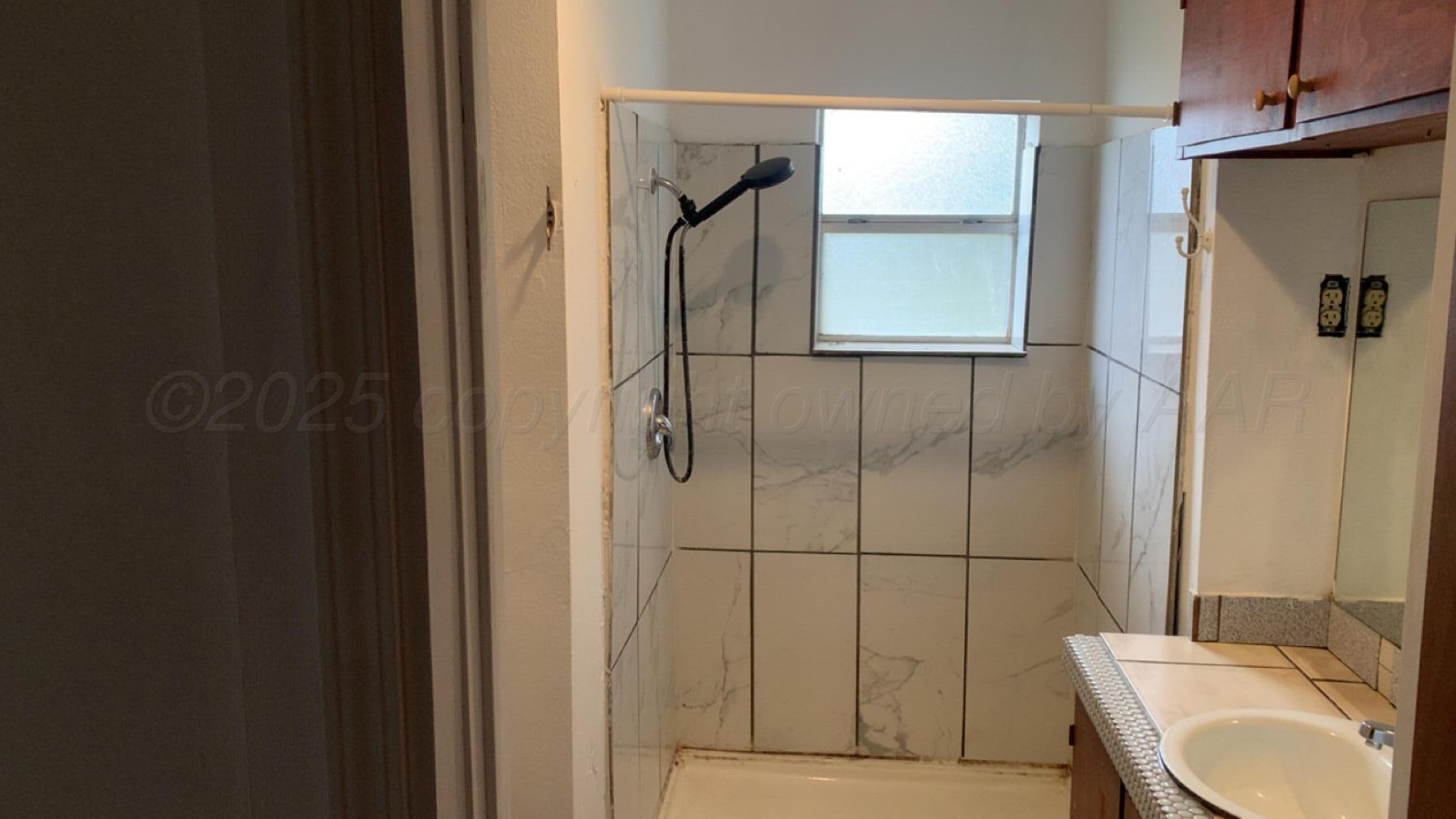 231 Main Street Quitaque, TX 79255 - Photo 16 of 23 a bathroom with a sink toilet and shower