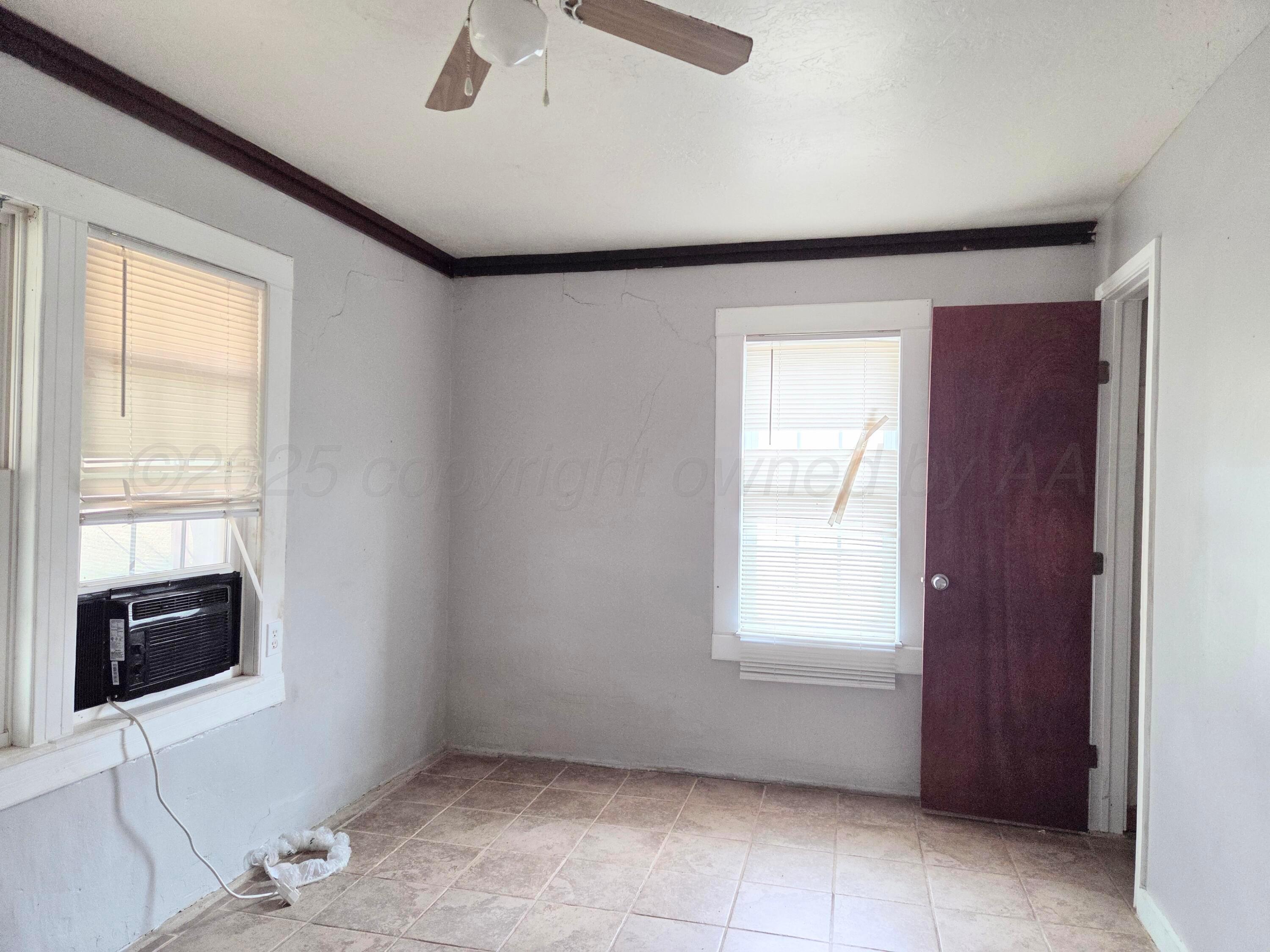 231 Main Street Quitaque, TX 79255 - Photo 18 of 23 a view of an empty room with a window