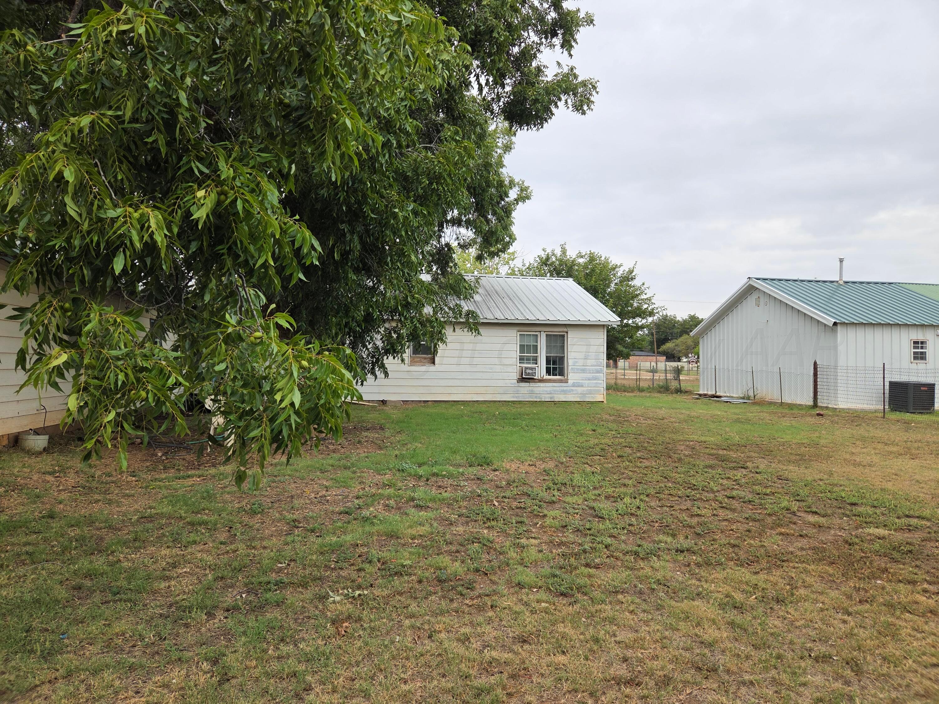 231 Main Street Quitaque, TX 79255 - Photo 23 of 23 a front view of a house with garden