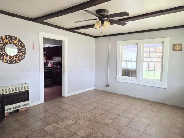 a view of an empty room with a window