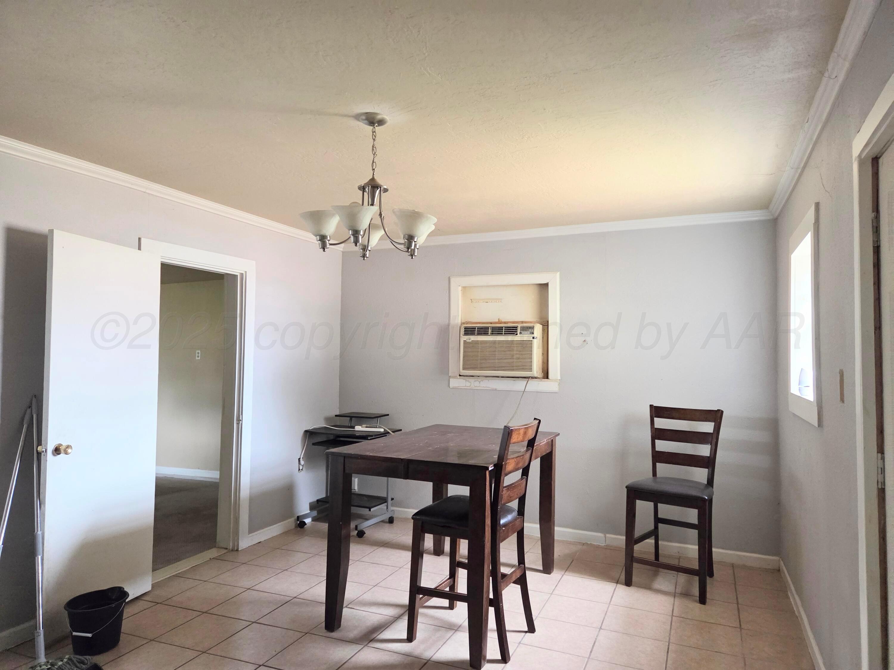 231 Main Street Quitaque, TX 79255 - Photo 6 of 23 a view of a dining room with furniture and wooden floor