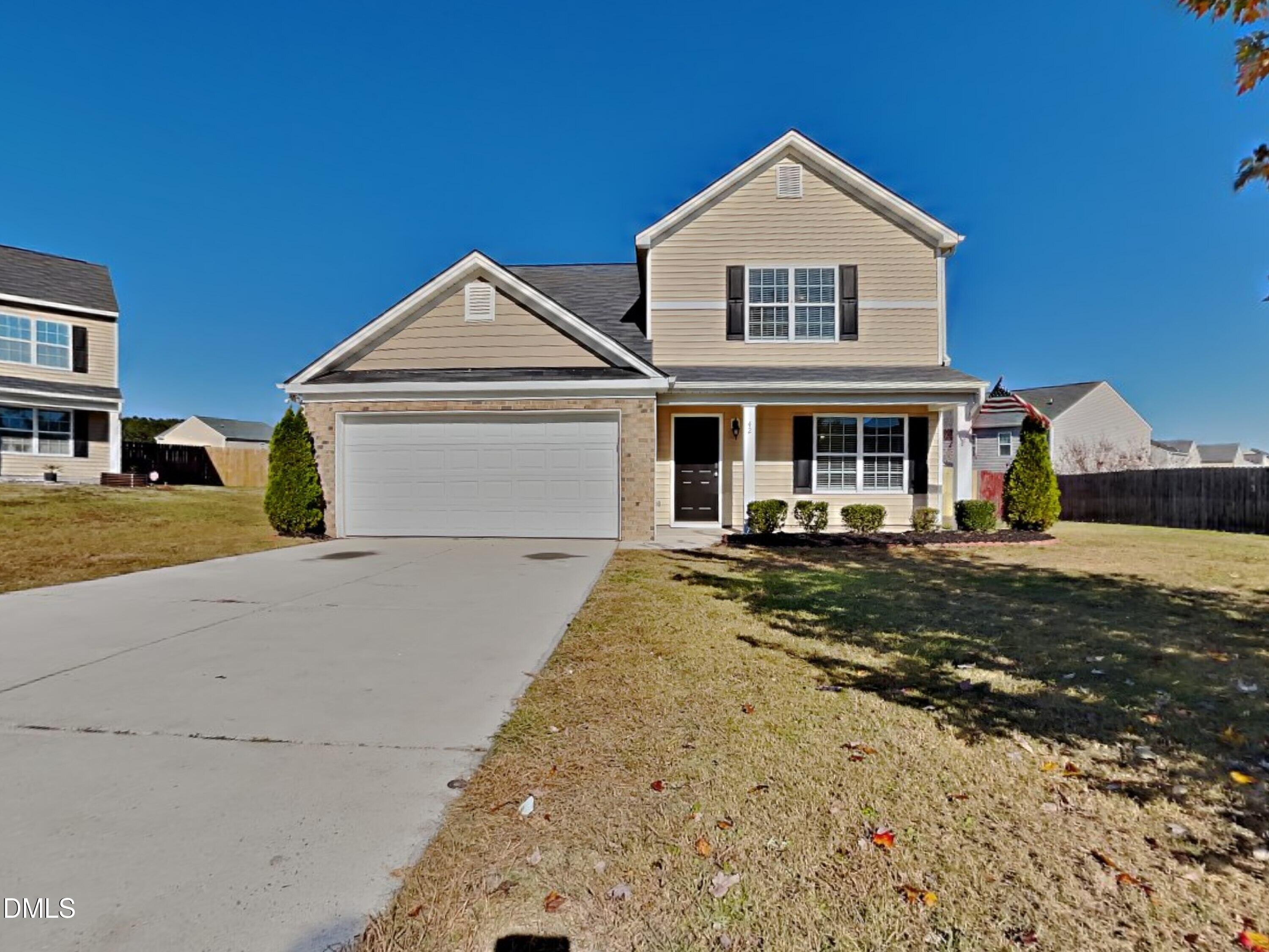 42 Folkstone Court Bunnlevel, NC 28323 - Photo 1 of 20 a front view of a house with a yard and garage