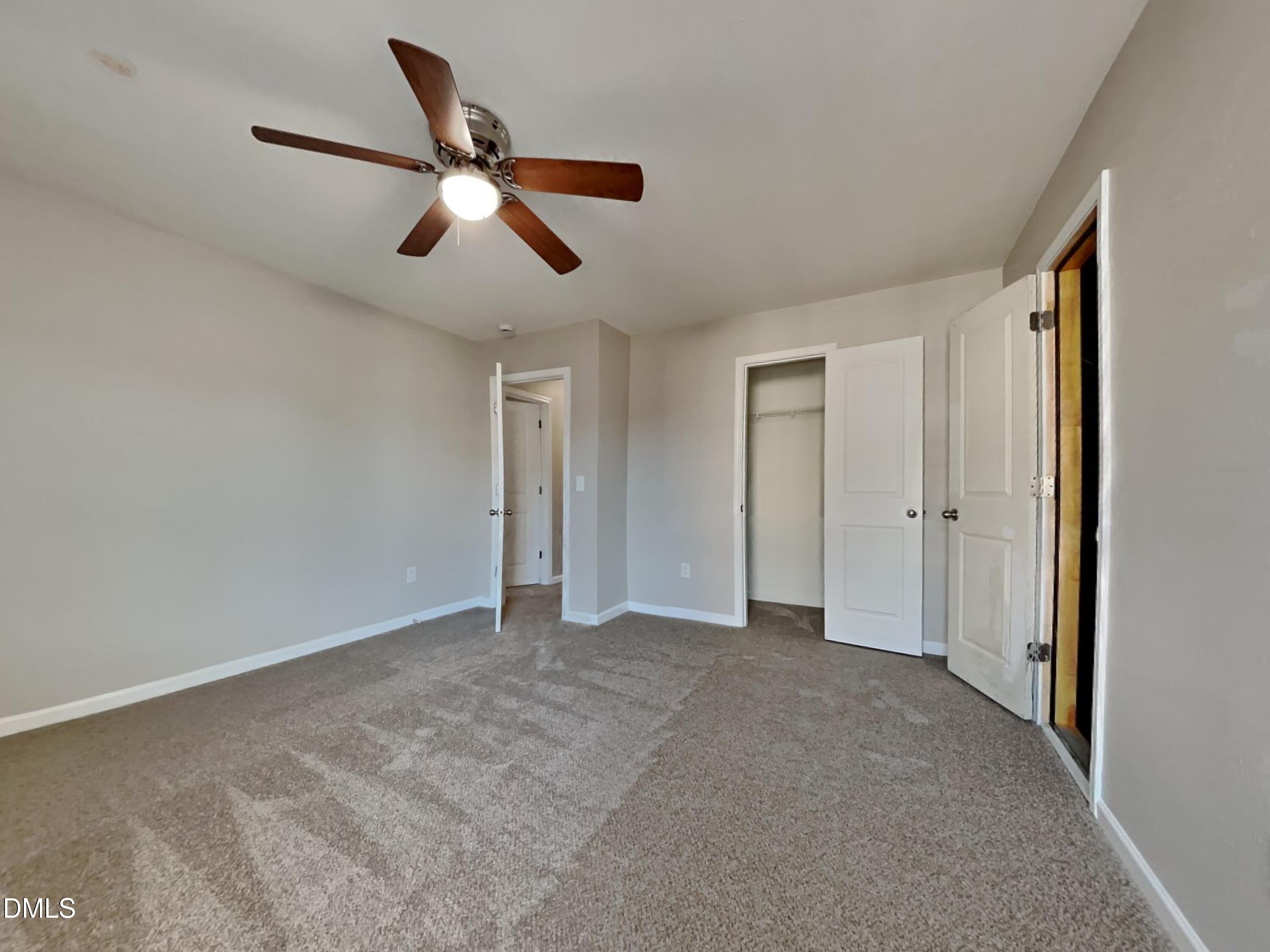 42 Folkstone Court Bunnlevel, NC 28323 - Photo 11 of 20 a view of empty room with ceiling fan
