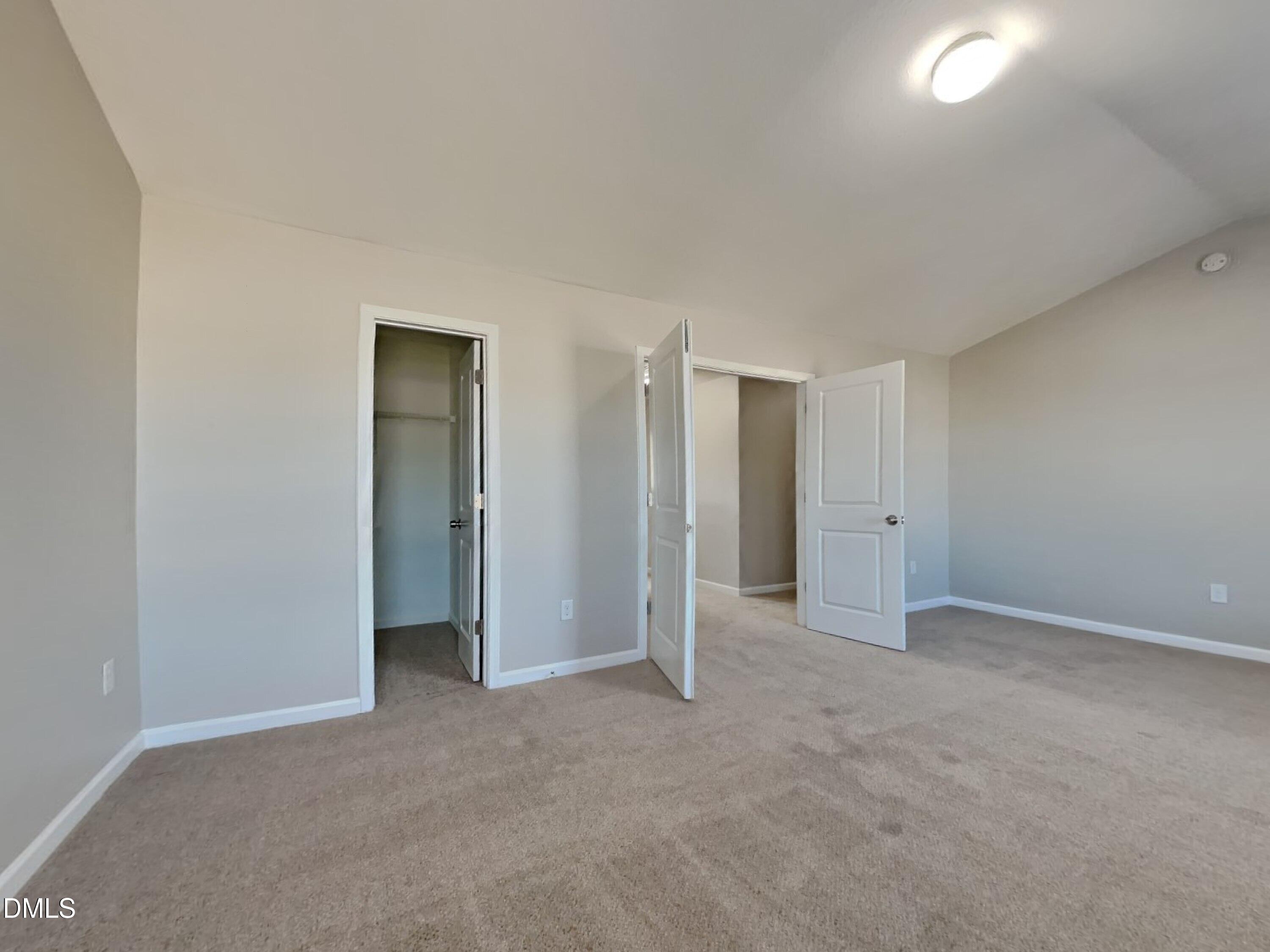 42 Folkstone Court Bunnlevel, NC 28323 - Photo 14 of 20 an empty room with closet and a bathroom