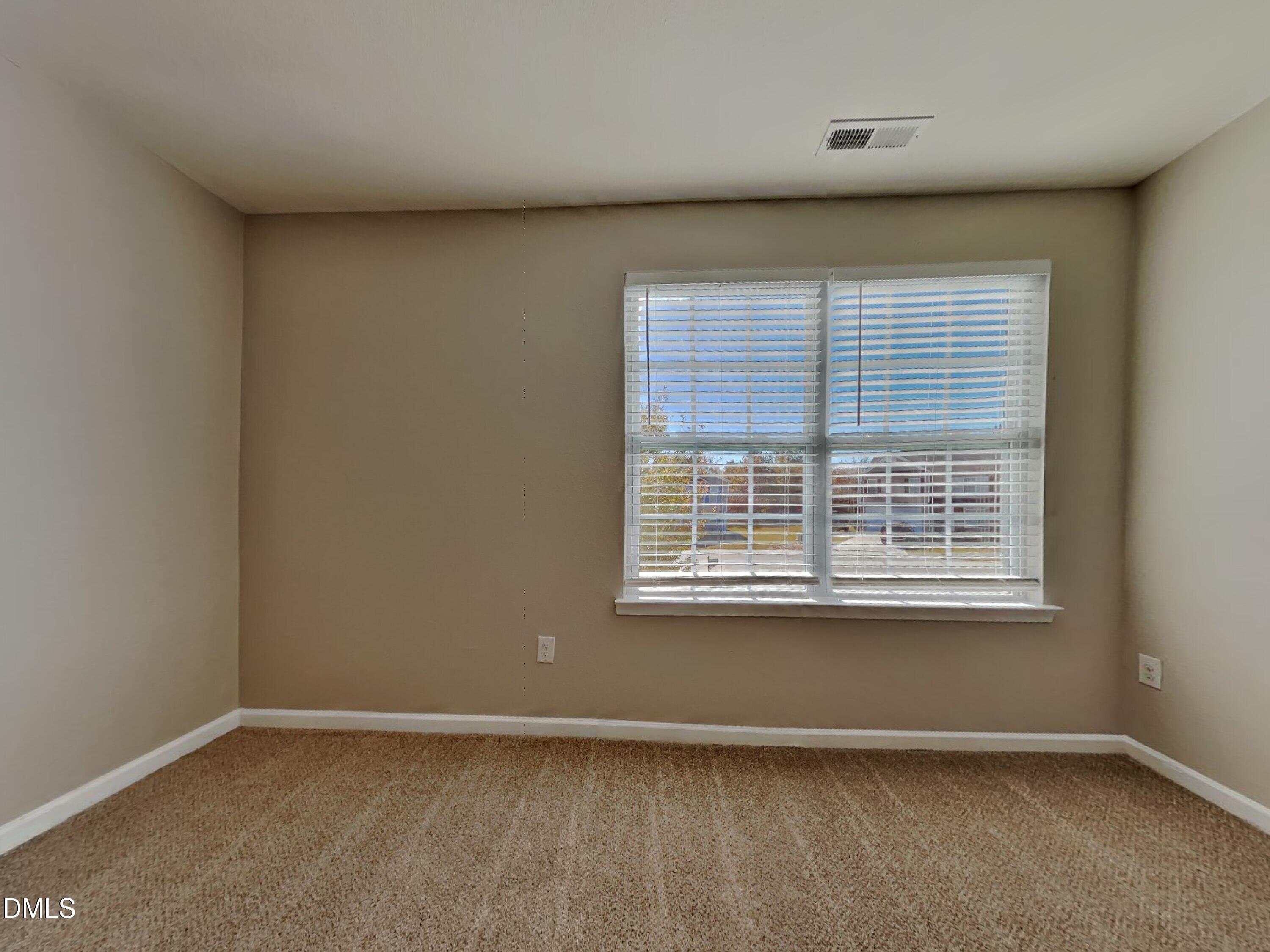 42 Folkstone Court Bunnlevel, NC 28323 - Photo 16 of 20 an empty room with a window