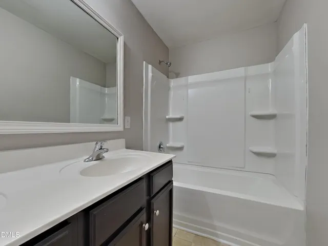 a bathroom with a sink and a bathtub
