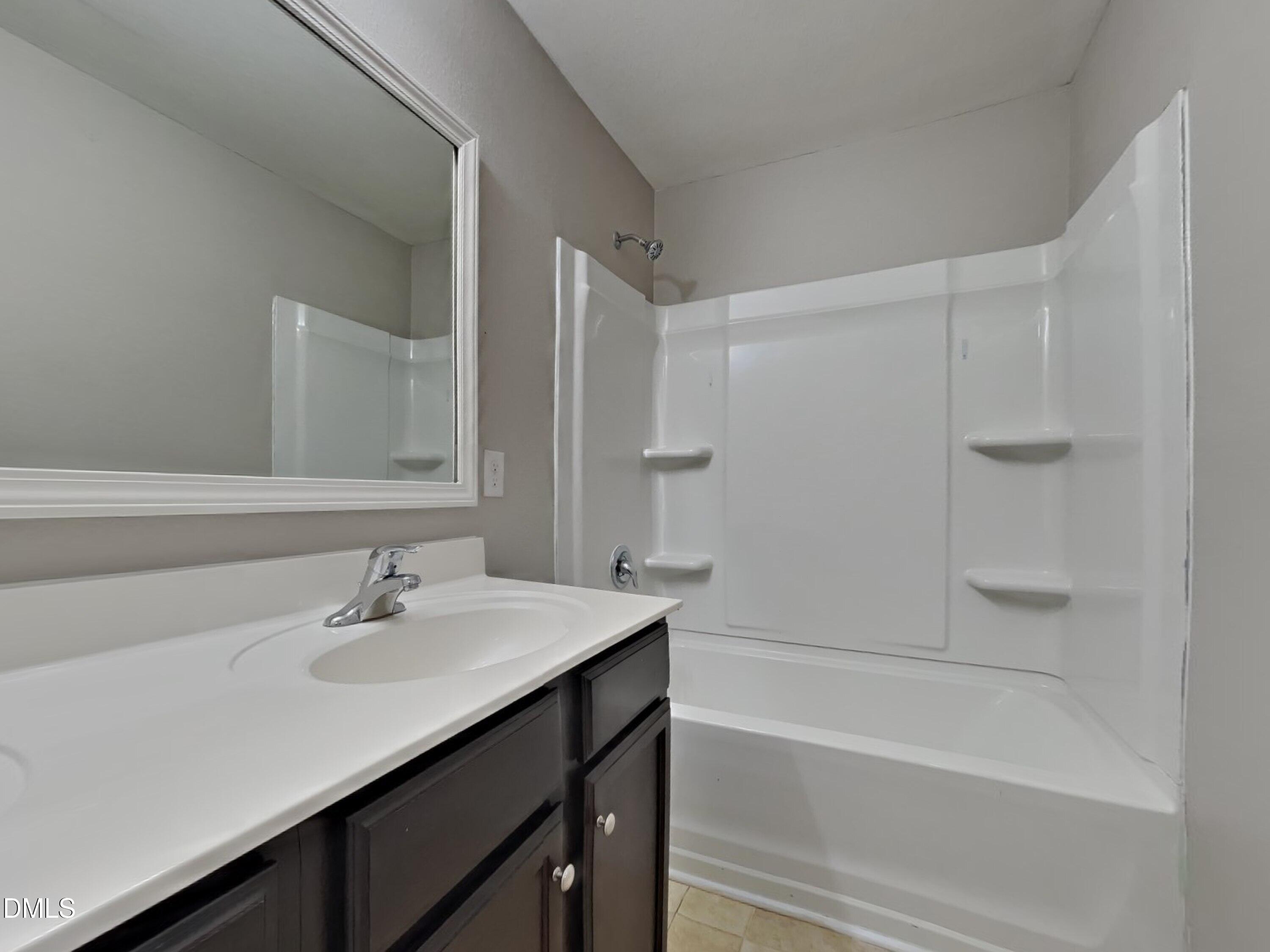 42 Folkstone Court Bunnlevel, NC 28323 - Photo 19 of 20 a bathroom with a sink and a bathtub