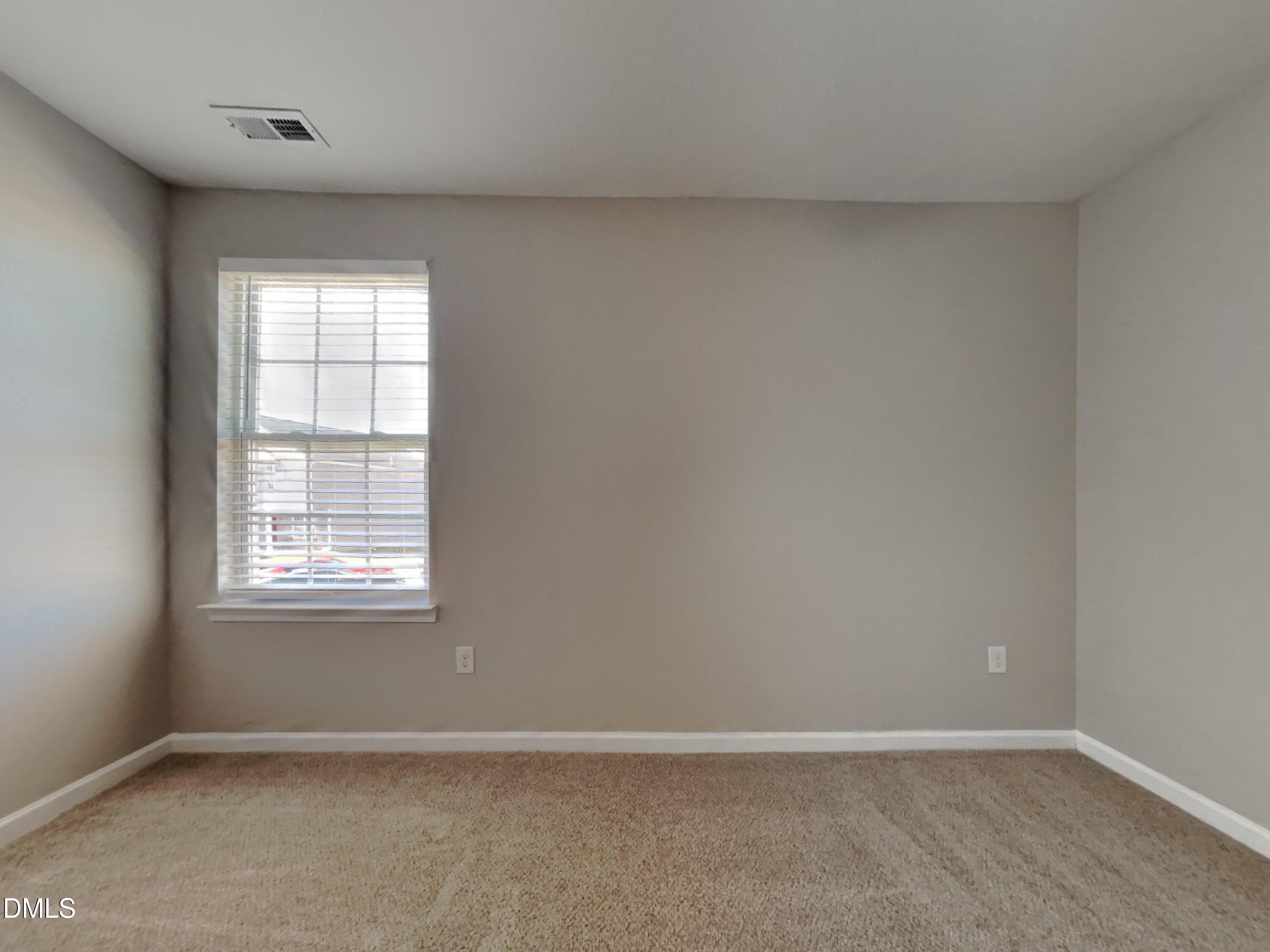 42 Folkstone Court Bunnlevel, NC 28323 - Photo 10 of 20 an empty room with a window