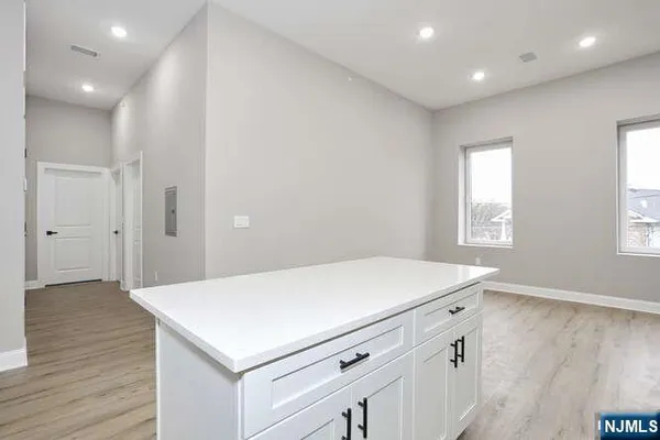 a kitchen with a refrigerator and a sink