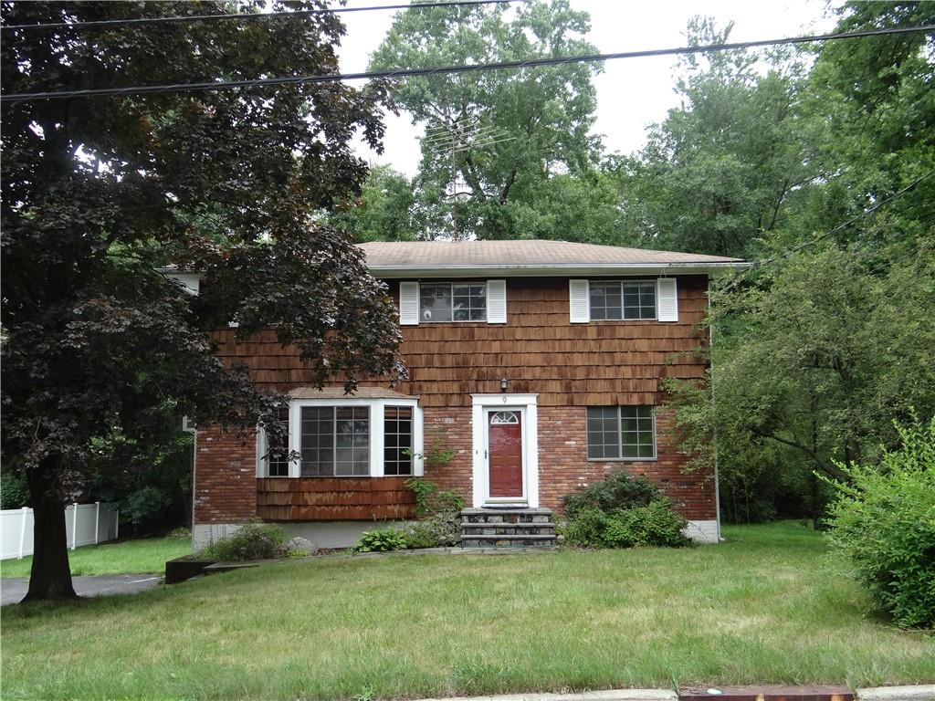 9 Downey Road Ossining, NY 10562 - Photo 1 of 1 a front view of a house with a garden