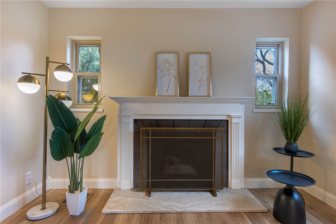 1012 Hampshire Road Dayton, OH 45419 - Photo 8 of 39 This inviting living space features a classic fireplace, perfect for cozy evenings.