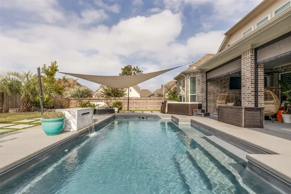 a view of a swimming pool with a patio