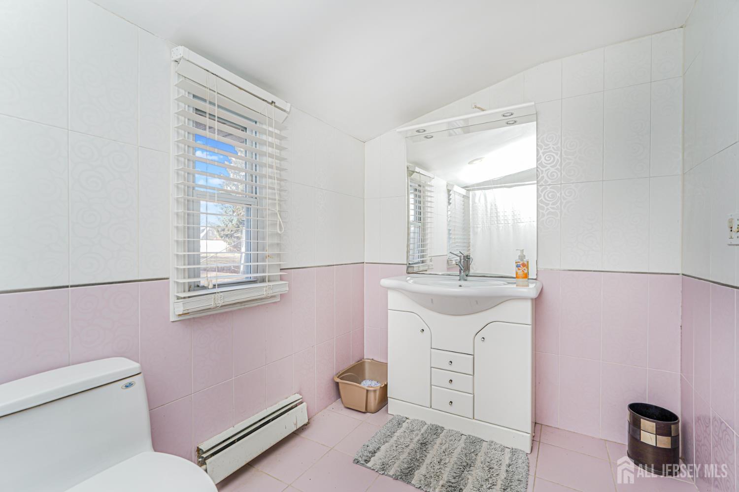 7 Walnut Lane Parlin, NJ 08859 - Photo 13 of 23 a bathroom with a sink toilet and vanity