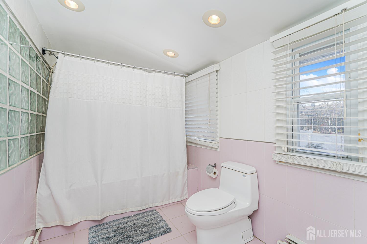 7 Walnut Lane Parlin, NJ 08859 - Photo 14 of 23 a bathroom with a sink toilet and shower